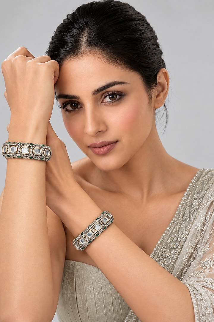 Gold Plated Moissanite Polki & Emerald Stone Bangles (Set Of 2) by Vivinia By Vidhi Mehra at Pernia's Pop Up Shop