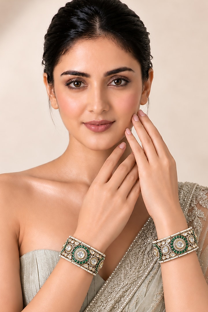 Gold Plated Moissanite Polki & Emerald Stone Bangles (Set Of 2) by Vivinia By Vidhi Mehra at Pernia's Pop Up Shop