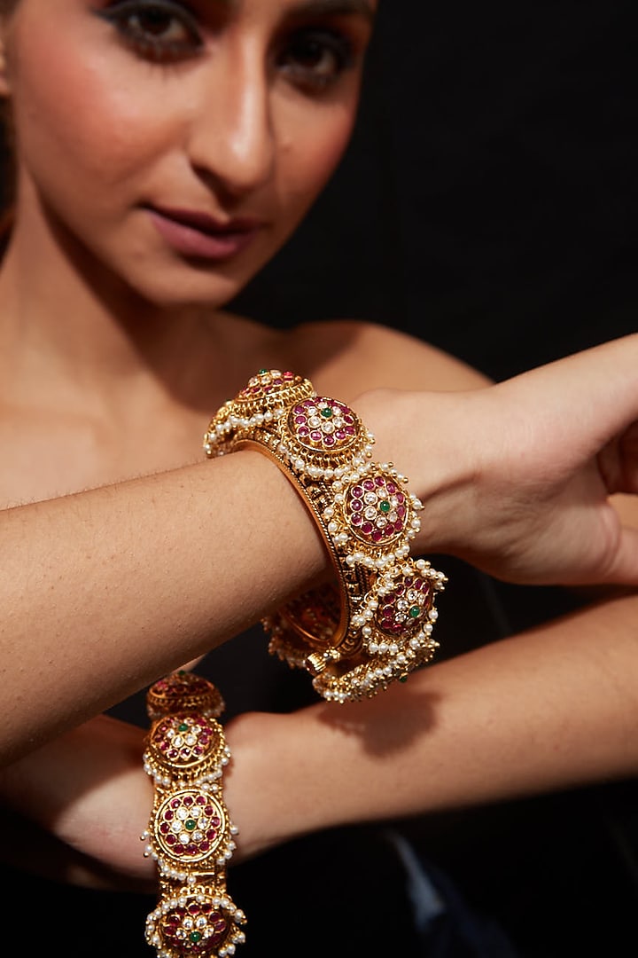 Gold Finish Kundan Polki Bangles (Set Of 2) by Vivinia By Vidhi Mehra at Pernia's Pop Up Shop