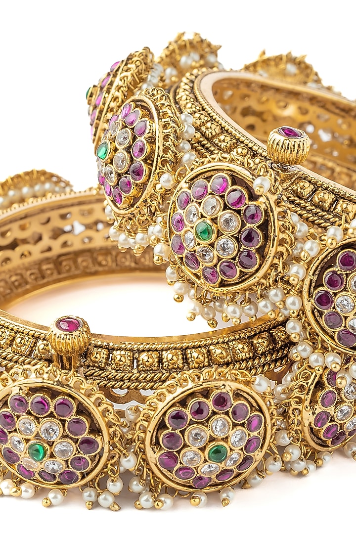 Gold Finish Kundan Polki Bangles (Set Of 2) by Vivinia By Vidhi Mehra at Pernia's Pop Up Shop
