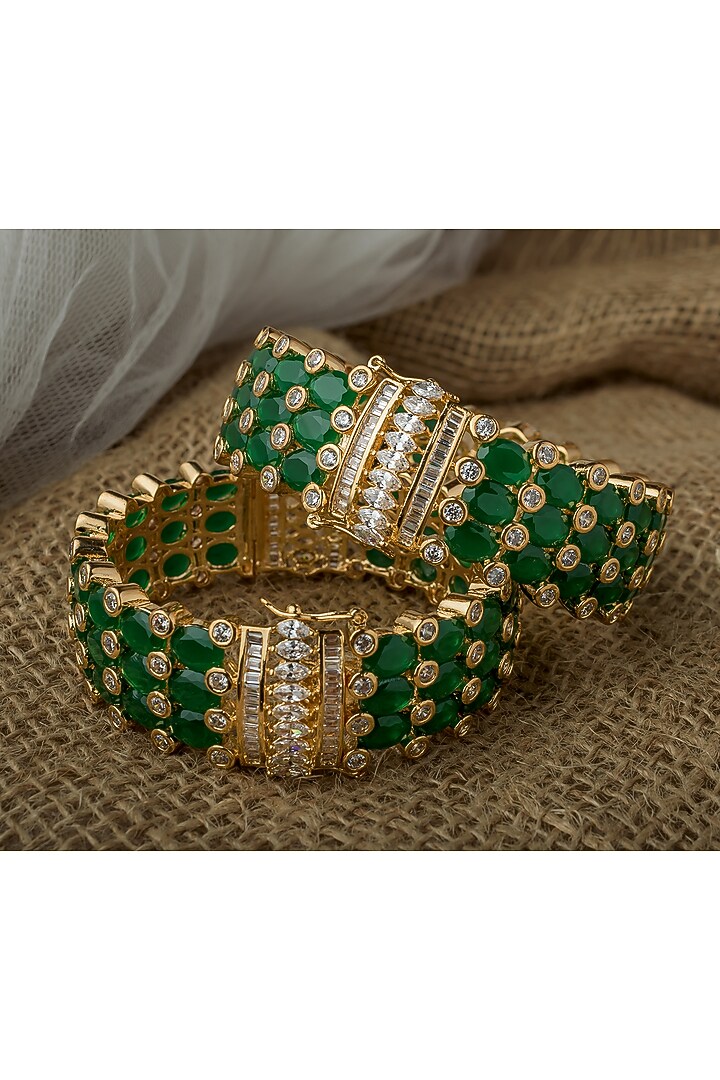 Gold Finish Kundan Polki & Green Stone Bangles (Set Of 2) by Vivinia By Vidhi Mehra at Pernia's Pop Up Shop