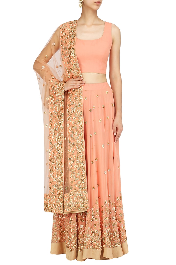 Peach embroidered lehenga set available only at Pernia's Pop Up Shop.