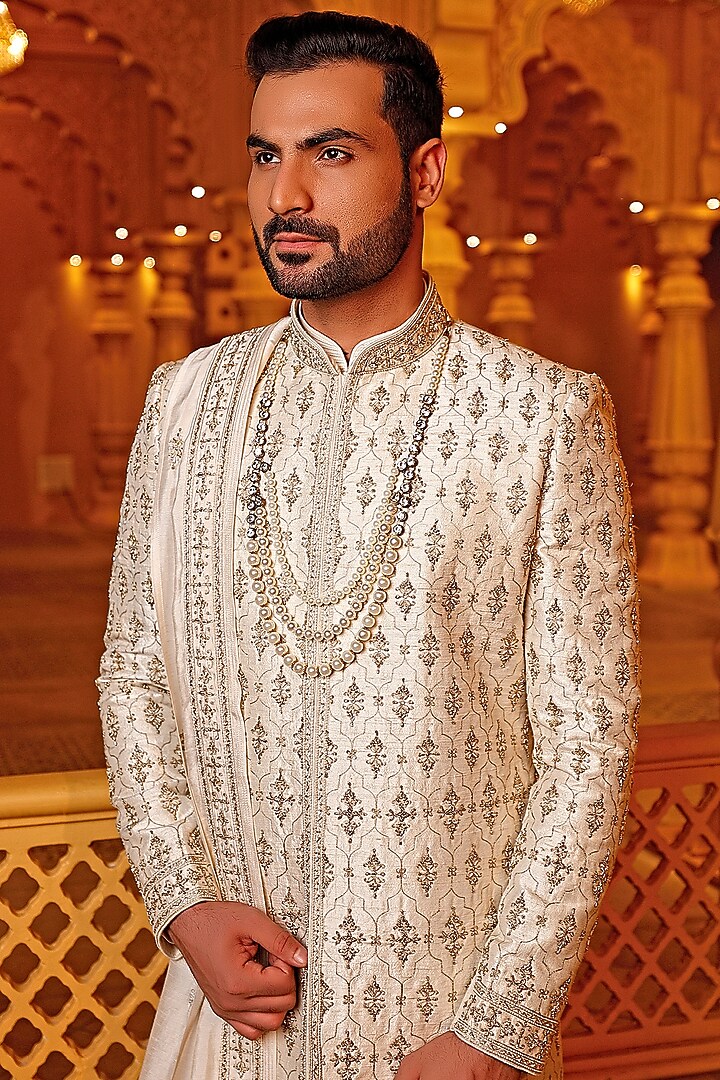 Cream Raw Silk Zari Embroidered Groom Sherwani Set by Vanshik at Pernia's Pop Up Shop