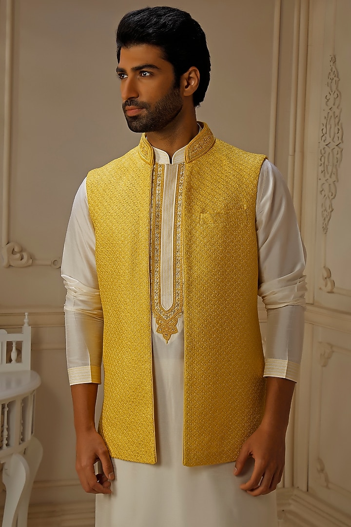 Yellow Dupion Silk Self Embroidered Bundi Jacket Set by Vanshik at Pernia's Pop Up Shop