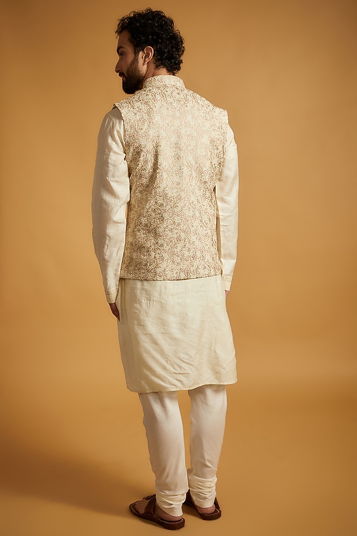 Cream Tussar Silk Floral Embroidered Bundi Jacket Set by Vanshik at Pernia's Pop Up Shop
