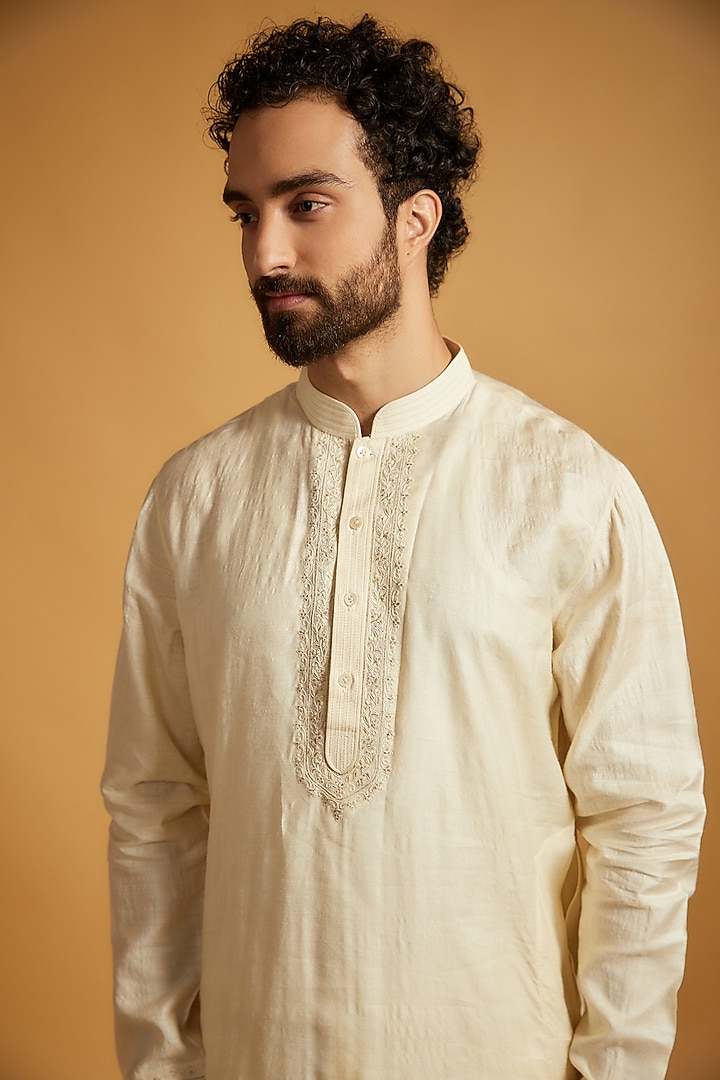 Cream Tussar Silk Floral Embroidered Bundi Jacket Set by Vanshik at Pernia's Pop Up Shop
