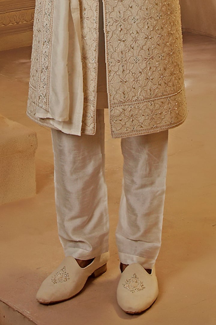 Pearl White Raw Silk Resham Floral Embroidered Groom Sherwani Set by Vanshik at Pernia's Pop Up Shop