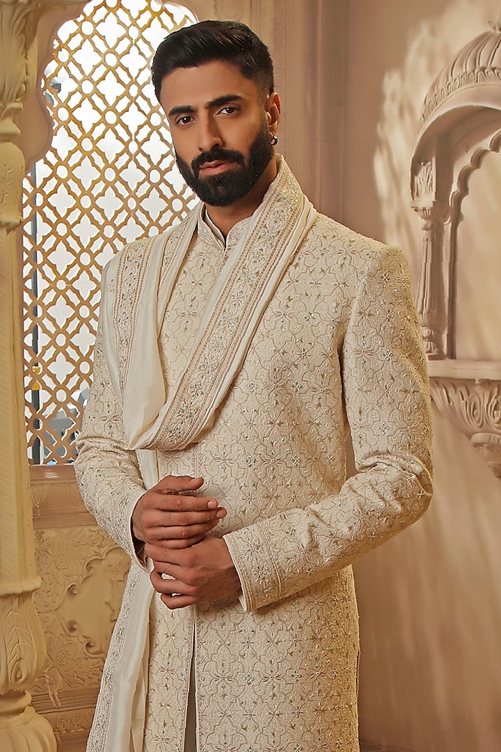 Pearl White Raw Silk Resham Floral Embroidered Groom Sherwani Set by Vanshik at Pernia's Pop Up Shop