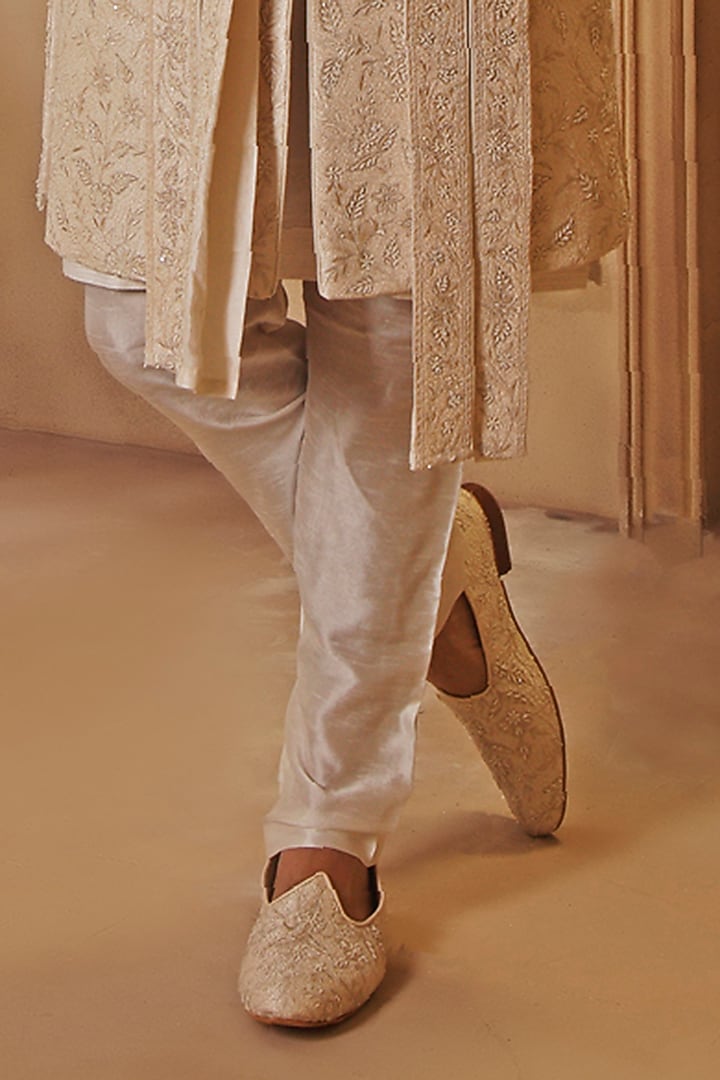 Pearl White Raw Silk Cutdana Embroidered Groom Sherwani Set by Vanshik at Pernia's Pop Up Shop