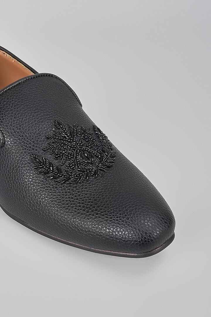 Black Leather Motif Embroidered Mojaris by Vanshik at Pernia's Pop Up Shop