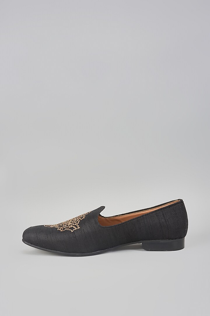 Black Raw Silk Motif Embroidered Mojaris by Vanshik at Pernia's Pop Up Shop