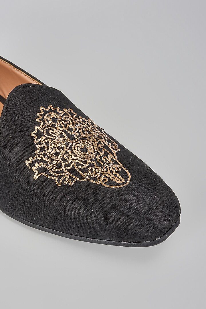 Black Raw Silk Motif Embroidered Mojaris by Vanshik at Pernia's Pop Up Shop
