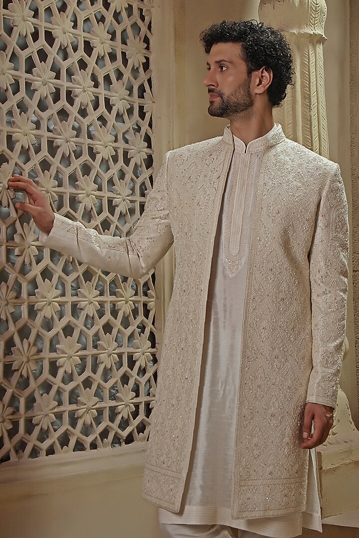 Pearl White Raw Silk Jaal Embroidered Groom Sherwani Set by Vanshik at Pernia's Pop Up Shop