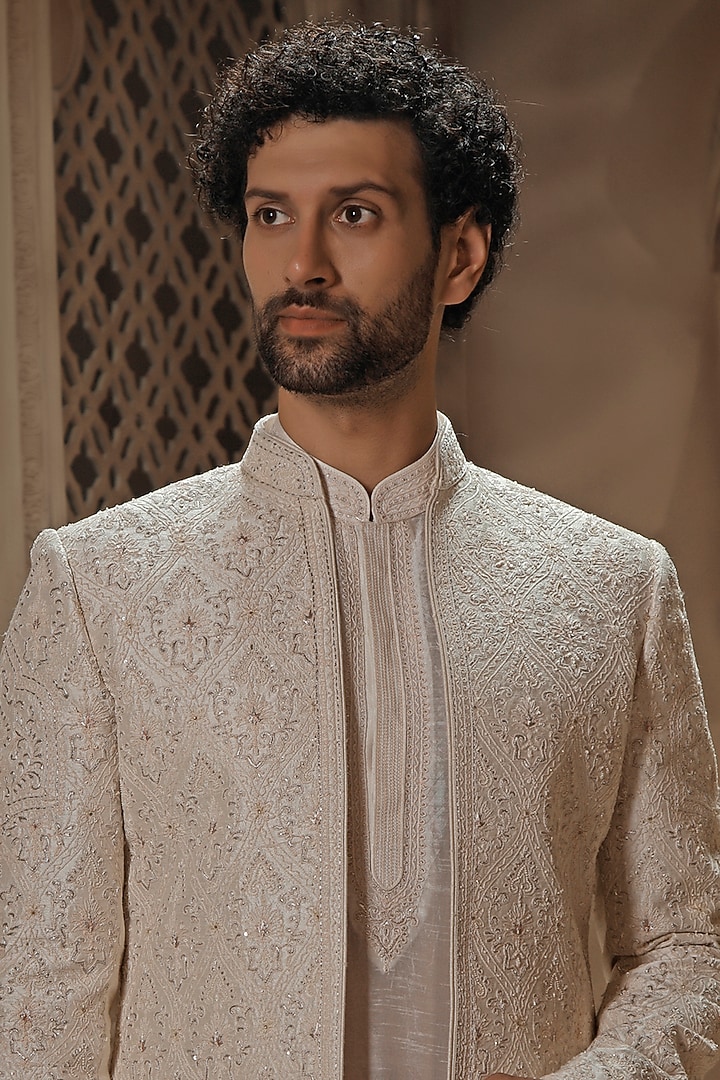 Pearl White Raw Silk Jaal Embroidered Groom Sherwani Set by Vanshik at Pernia's Pop Up Shop