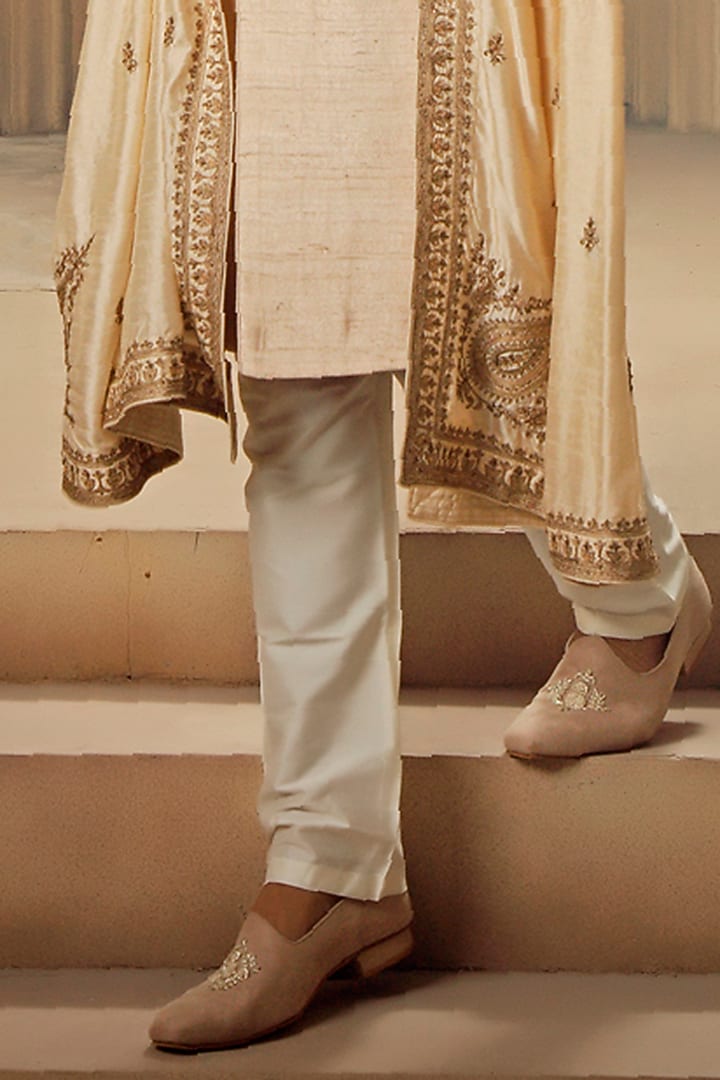 Beige Raw Silk Tilla Embroidered Groom Sherwani Set by Vanshik at Pernia's Pop Up Shop