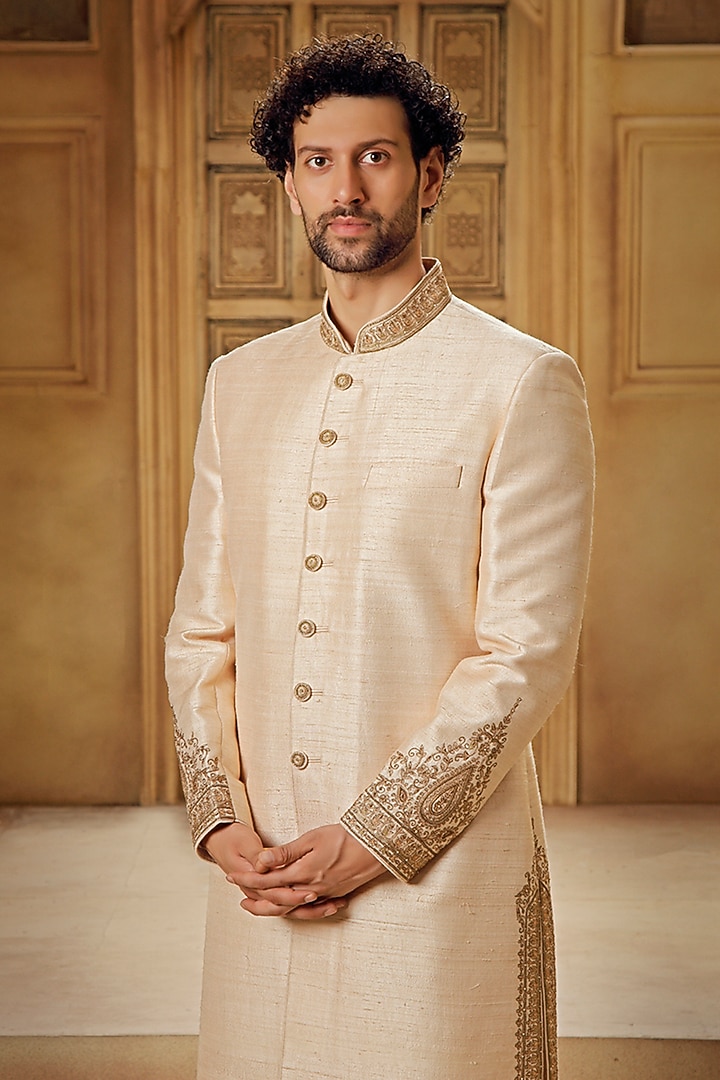 Beige Raw Silk Tilla Embroidered Groom Sherwani Set by Vanshik at Pernia's Pop Up Shop
