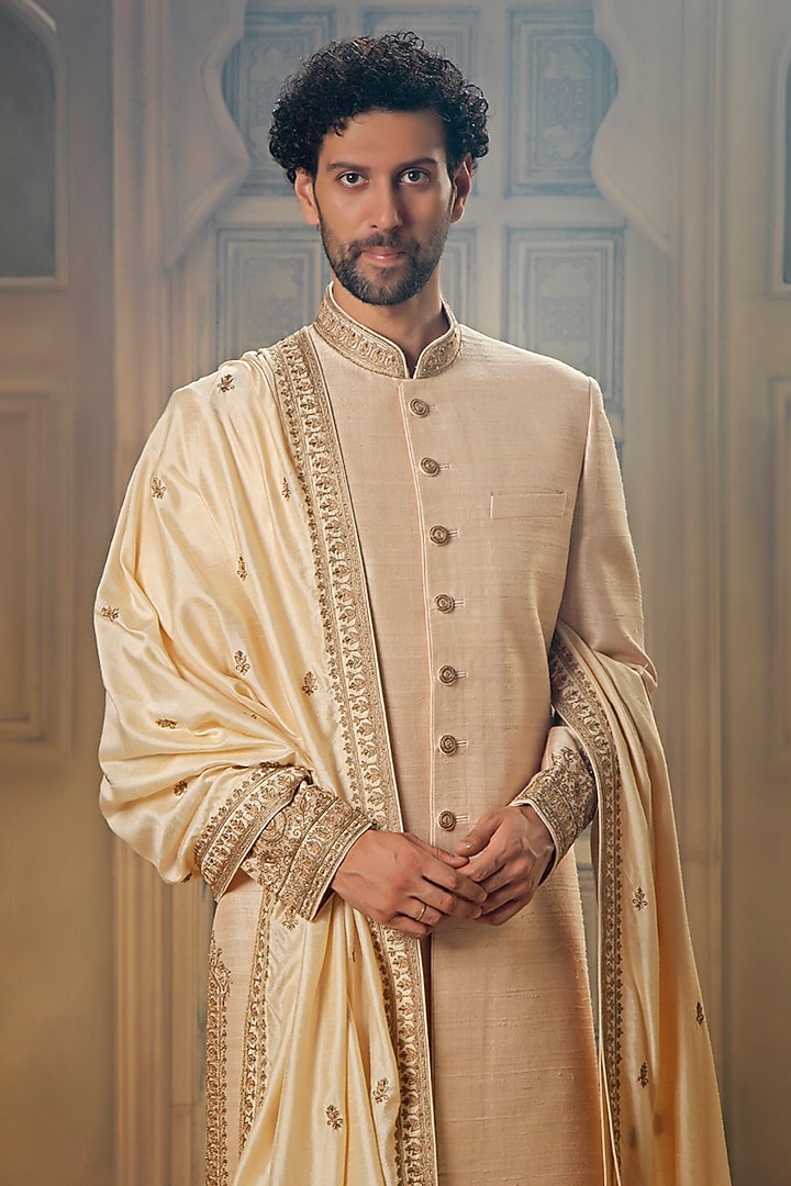 Beige Raw Silk Tilla Embroidered Groom Sherwani Set by Vanshik at Pernia's Pop Up Shop
