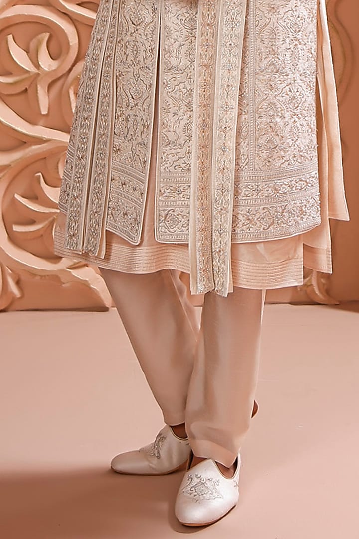 Cream Raw Silk Aari Hand Embroidered Groom Sherwani Set by Vanshik at Pernia's Pop Up Shop