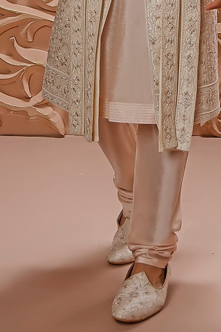 Cream Raw Silk Aari Embroidered Groom Sherwani Set by Vanshik at Pernia's Pop Up Shop