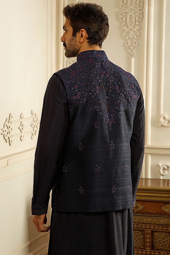 Blue Raw Silk Aari Embroidered Bundi Jacket Set by Vanshik at Pernia's Pop Up Shop