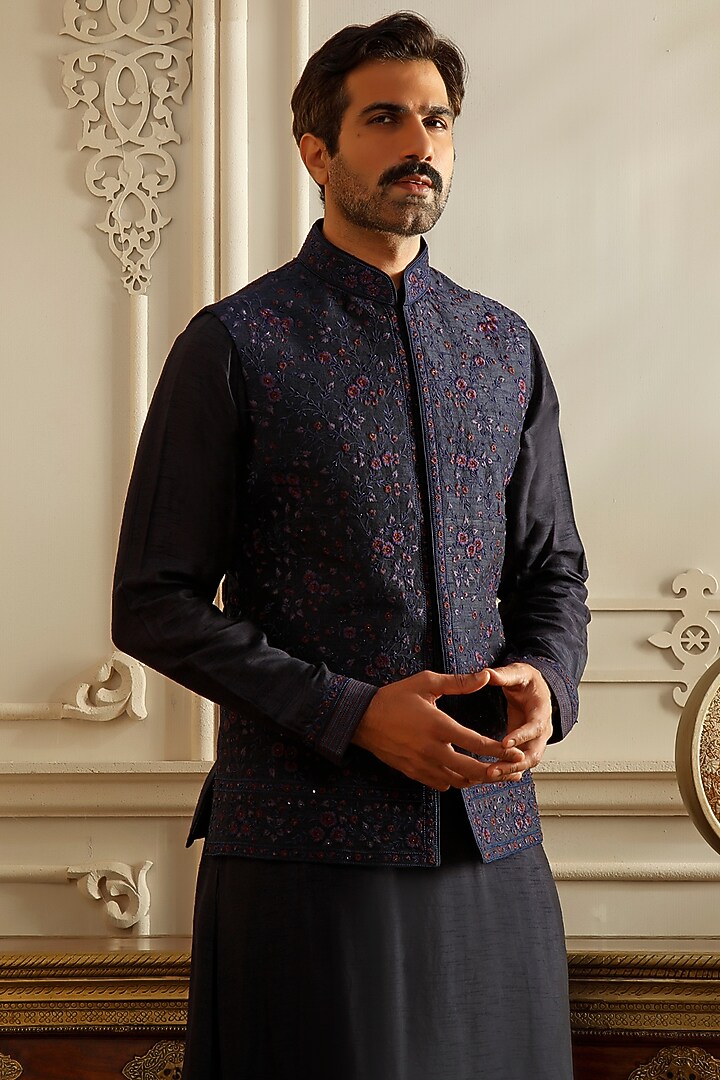 Blue Raw Silk Aari Embroidered Bundi Jacket Set by Vanshik at Pernia's Pop Up Shop