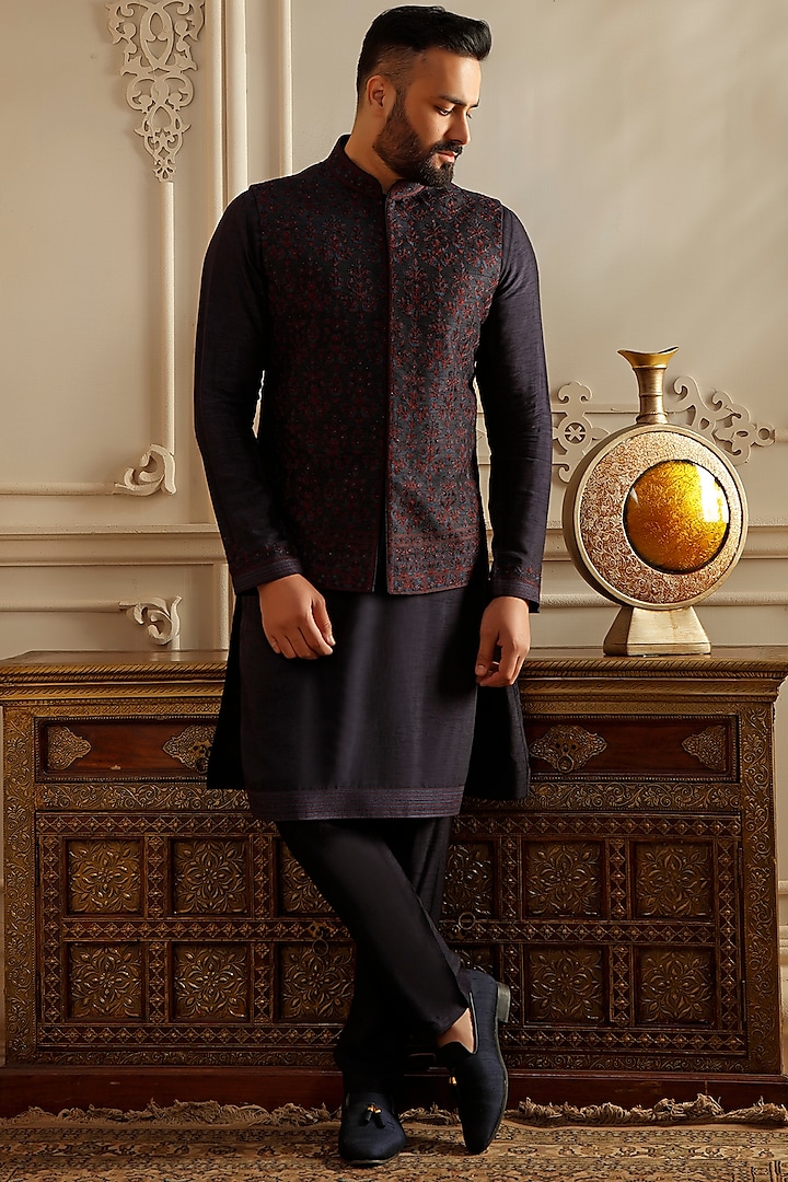Blue Raw Silk Aari Embroidered Bundi Jacket Set by Vanshik