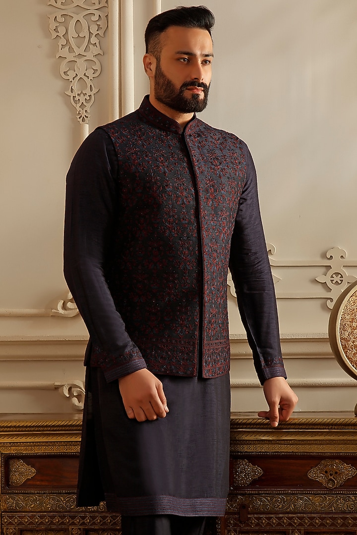 Blue Raw Silk Aari Embroidered Bundi Jacket Set by Vanshik at Pernia's Pop Up Shop
