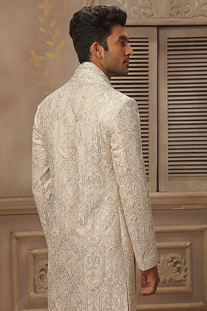 Cream Raw Silk Aari Hand Embroidered Groom Sherwani Set by Vanshik at Pernia's Pop Up Shop