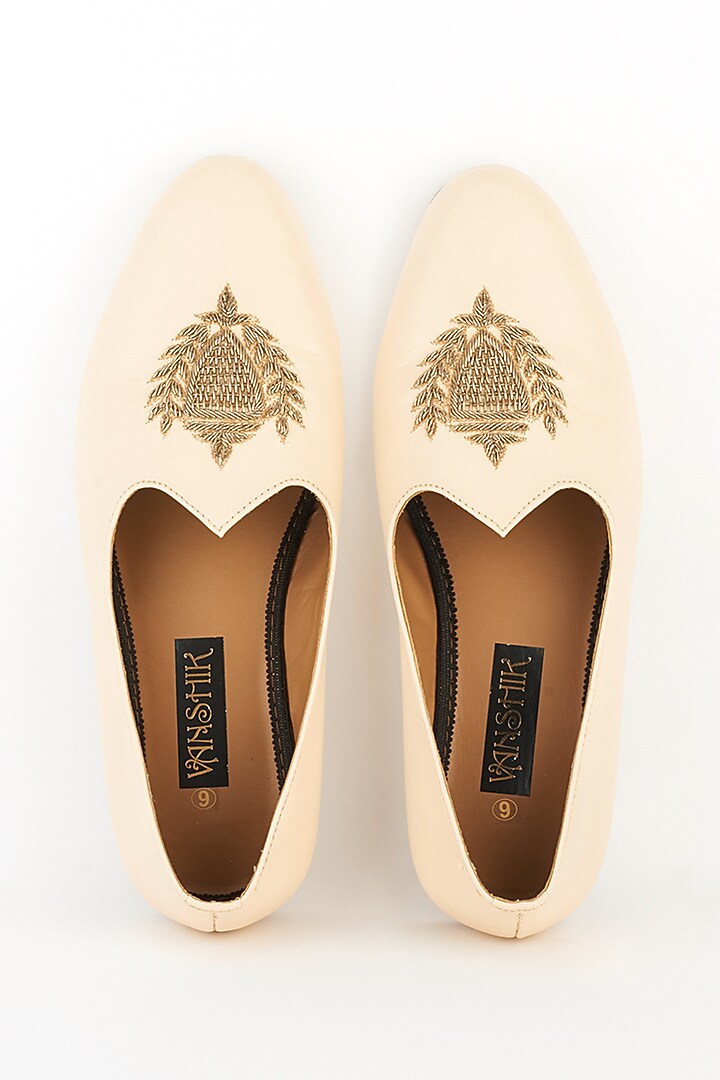 Cream Processed Leather Zardosi Embroidered Mojaris by Vanshik at Pernia's Pop Up Shop