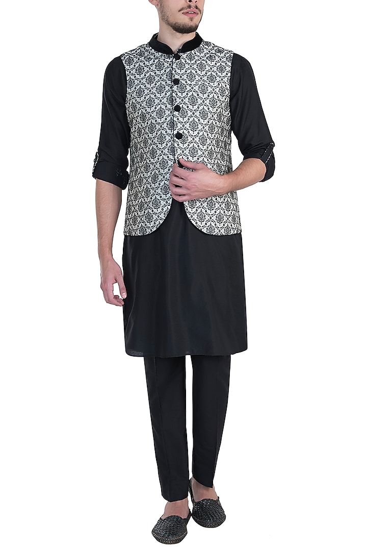 Beige bundi jacket with kurta and churidar pants available only at Pernia's Pop Up Shop.