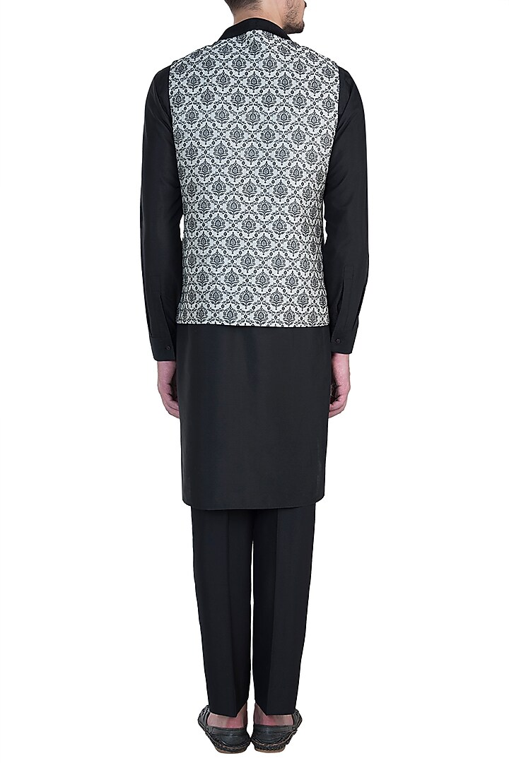 Beige bundi jacket with kurta and churidar pants available only at Pernia's Pop Up Shop.