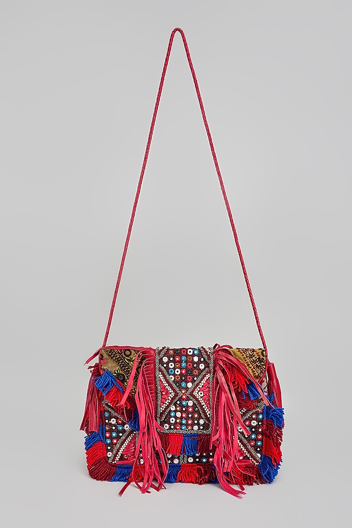 Red Banjara Patch Fabric Tassels & Thread Embroidered Handcrafted Sling Bag by Vipul Shah Bags at Pernia's Pop Up Shop
