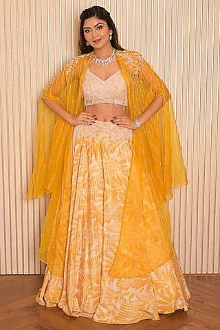 Yellow Silk Crepe Printed Jacket Lehenga Set by Vridhi Somaani
