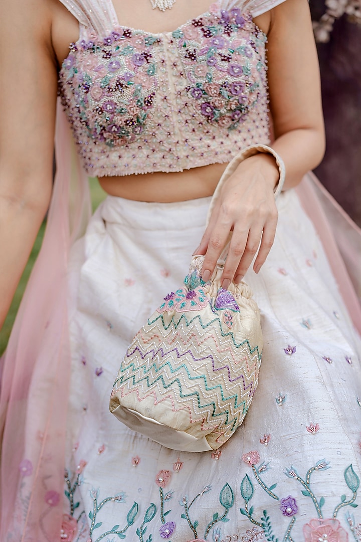 Ivory Raw Silk Pearl Hand Embroidered Wedding Lehenga Set by Vridhi Somaani at Pernia's Pop Up Shop