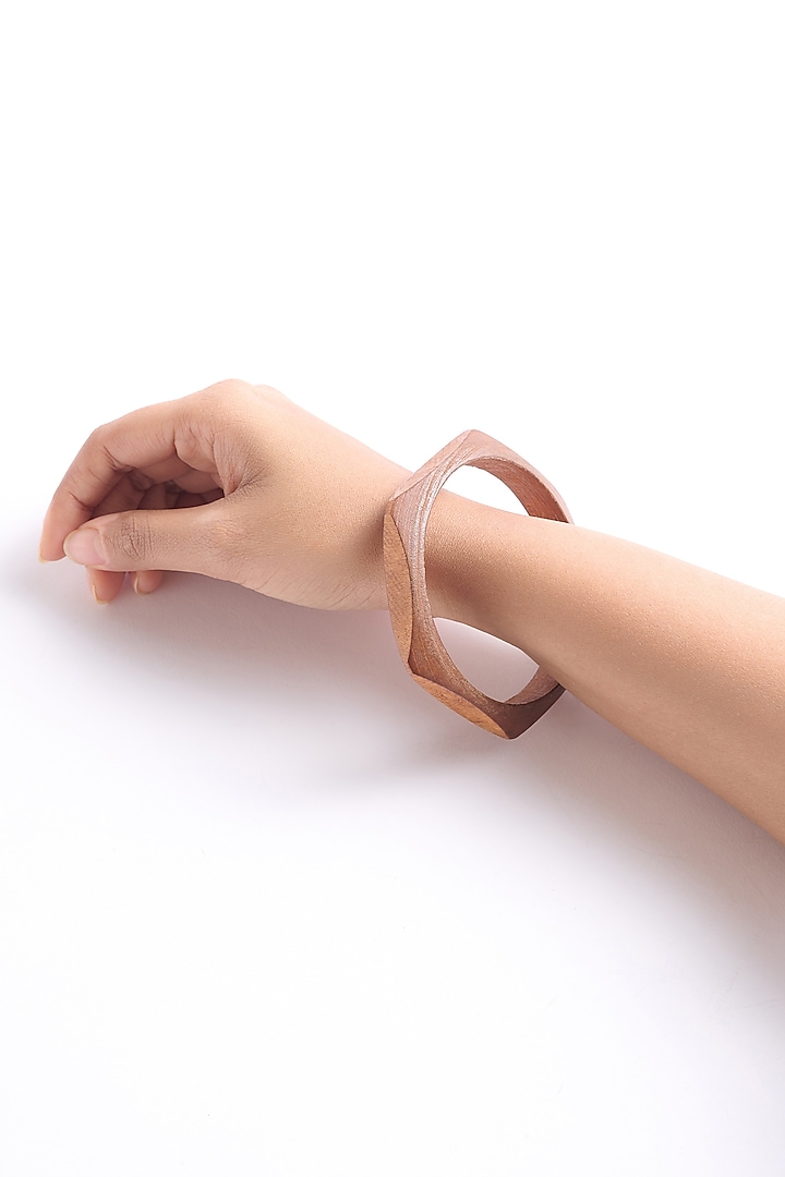 Gold Finish Hexagon-Shaped Wooden Bangle by Virago Jewellery at Pernia's Pop Up Shop