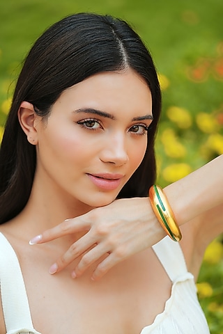 Gold Plated Green Enameled Circlet Bangle by Varnika Arora
