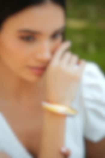 Gold Plated White Enameled Circlet Bangle by Varnika Arora at Pernia's Pop Up Shop