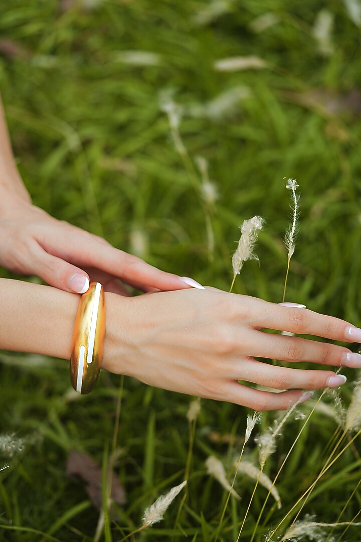 Gold Plated White Enameled Circlet Bangle by Varnika Arora at Pernia's Pop Up Shop