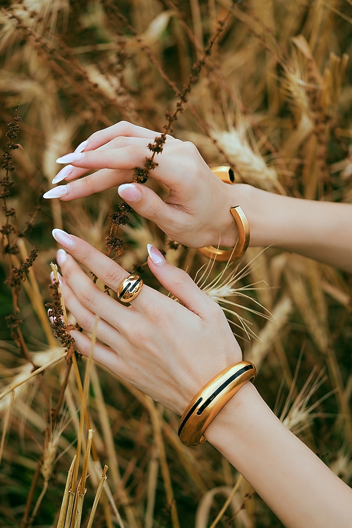 Gold Plated Black Enameled Circlet Bangle by Varnika Arora at Pernia's Pop Up Shop