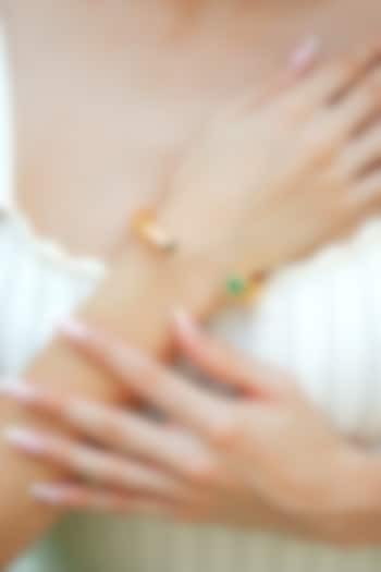 Gold Plated Green Enameled Cuff Bangle by Varnika Arora at Pernia's Pop Up Shop