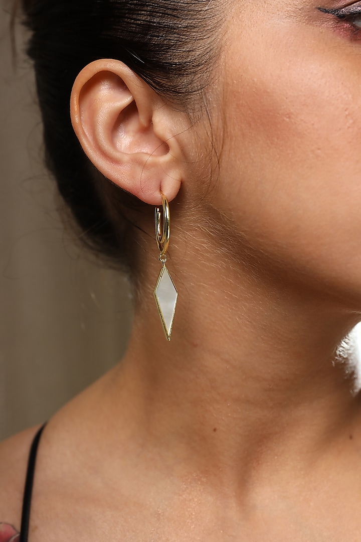 Gold Finish Mother Of Pearl Earrings by Varnika Arora