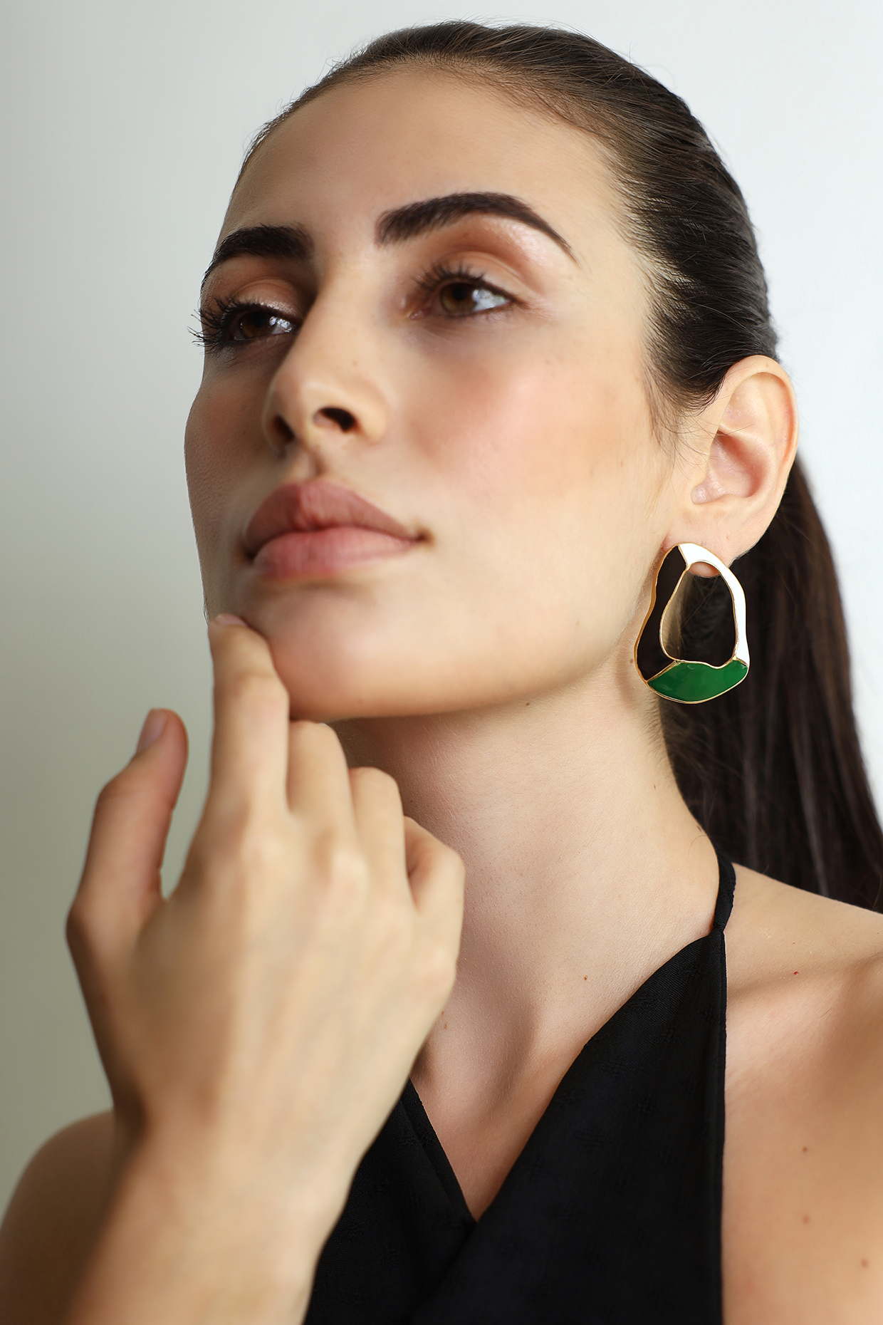 Gold Finish Crest Stud Earrings by Varnika Arora at Pernia's Pop Up Shop