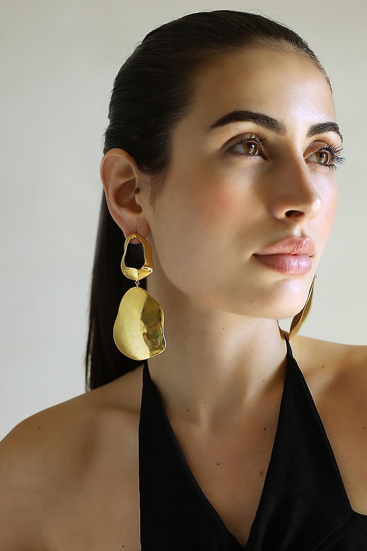 Gold Finish Fluid Curved Dangler Earrings by Varnika Arora