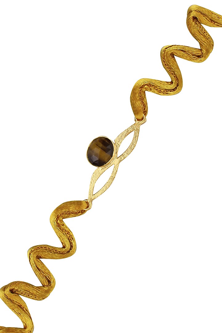 Varnika Arora presents Tiger's eye semi precious cut stone statement rakhi available only at Pernia's Pop Up Shop.