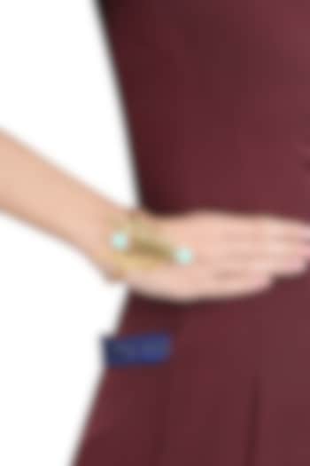 Varnika Arora presents Gold plated cut stones amazonite statement wrist palm cuff available only at Pernia's Pop Up Shop.