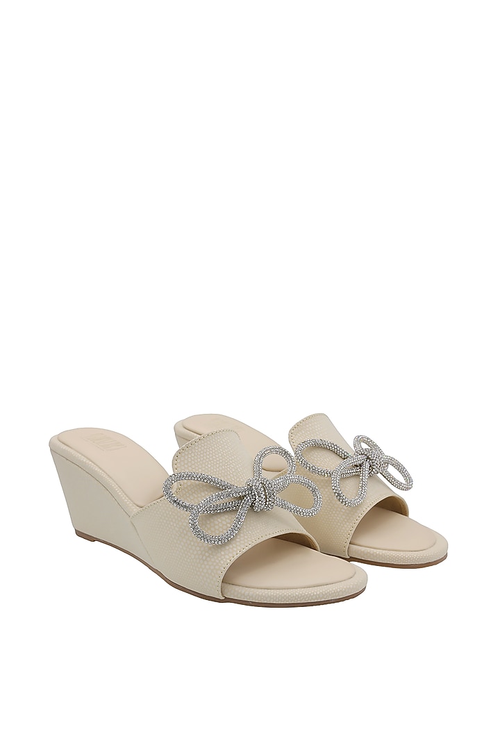 Cream Faux Leather Wedges by Veruschka By Payal Kothari at Pernia's Pop Up Shop
