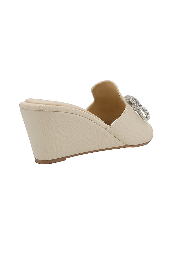 Cream Faux Leather Wedges by Veruschka By Payal Kothari at Pernia's Pop Up Shop