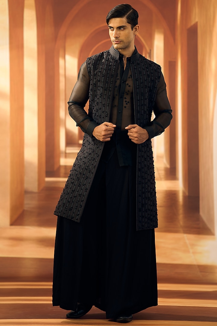 Black Semi Raw Silk Machine Embroidered Sleeveless Open Wedding Sherwani by Vivek Karunakaran at Pernia's Pop Up Shop