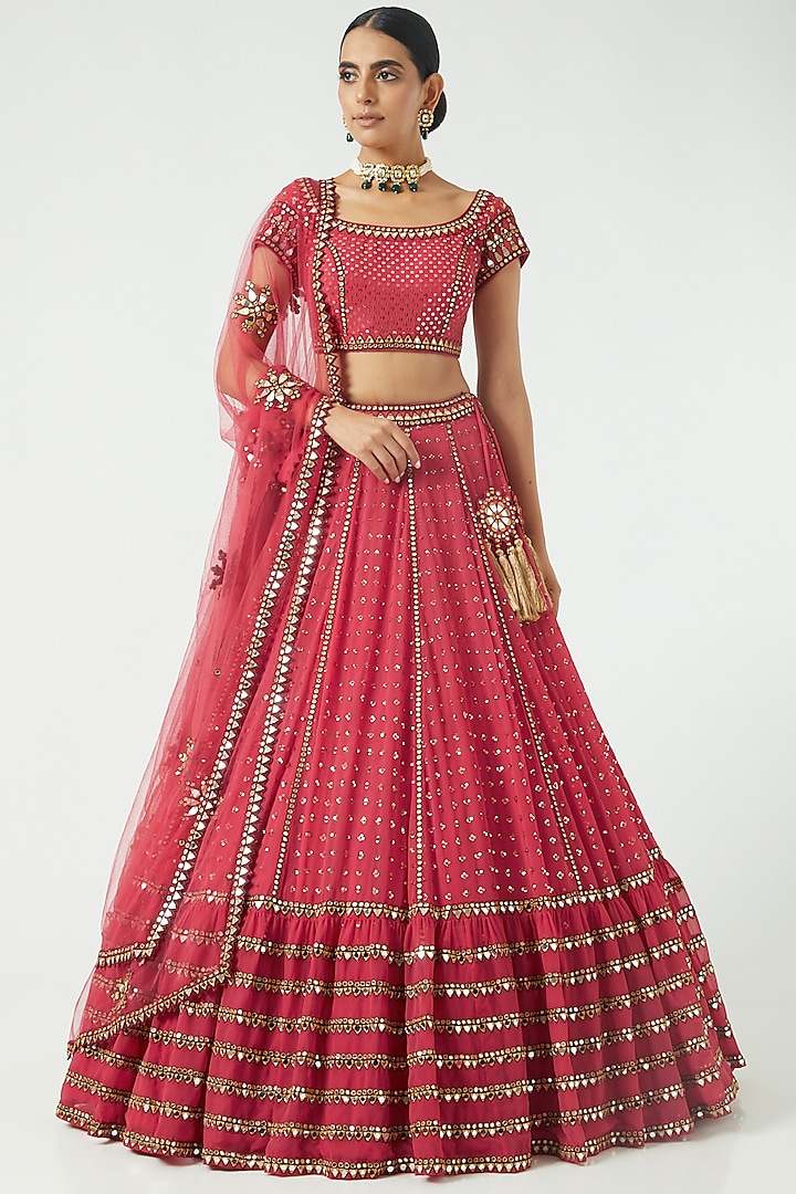 Deep Coral Georgette Sequined Tiered Lehenga Set by Vvani By Vani Vats