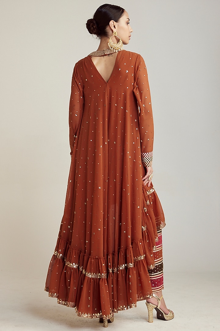 Rust Georgette Asymmetrical Kurta Set by Vvani by Vani Vats at Pernia's Pop Up Shop